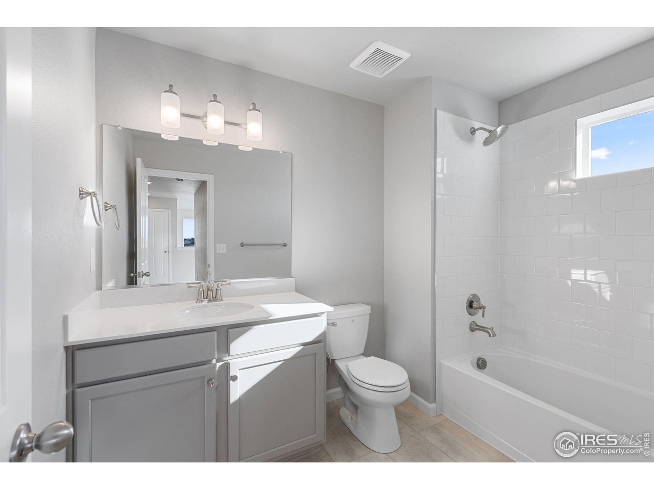 6765 Utica Court Firestone, CO 80504 - Photo 18 of 23 a bathroom with a sink a toilet a mirror and shower
