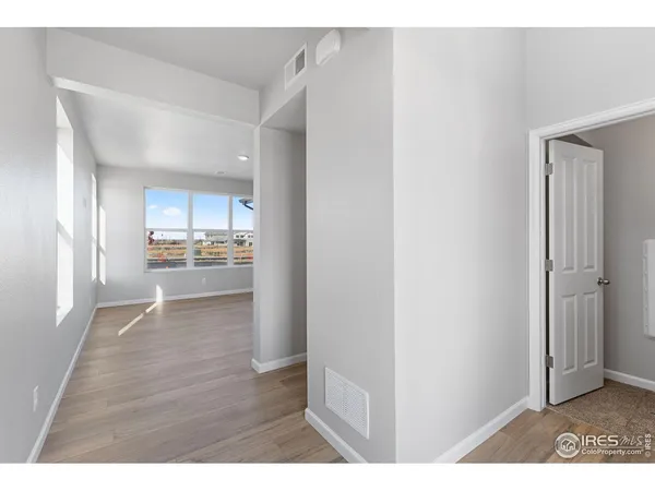 a view of a kitchen with wooden floor