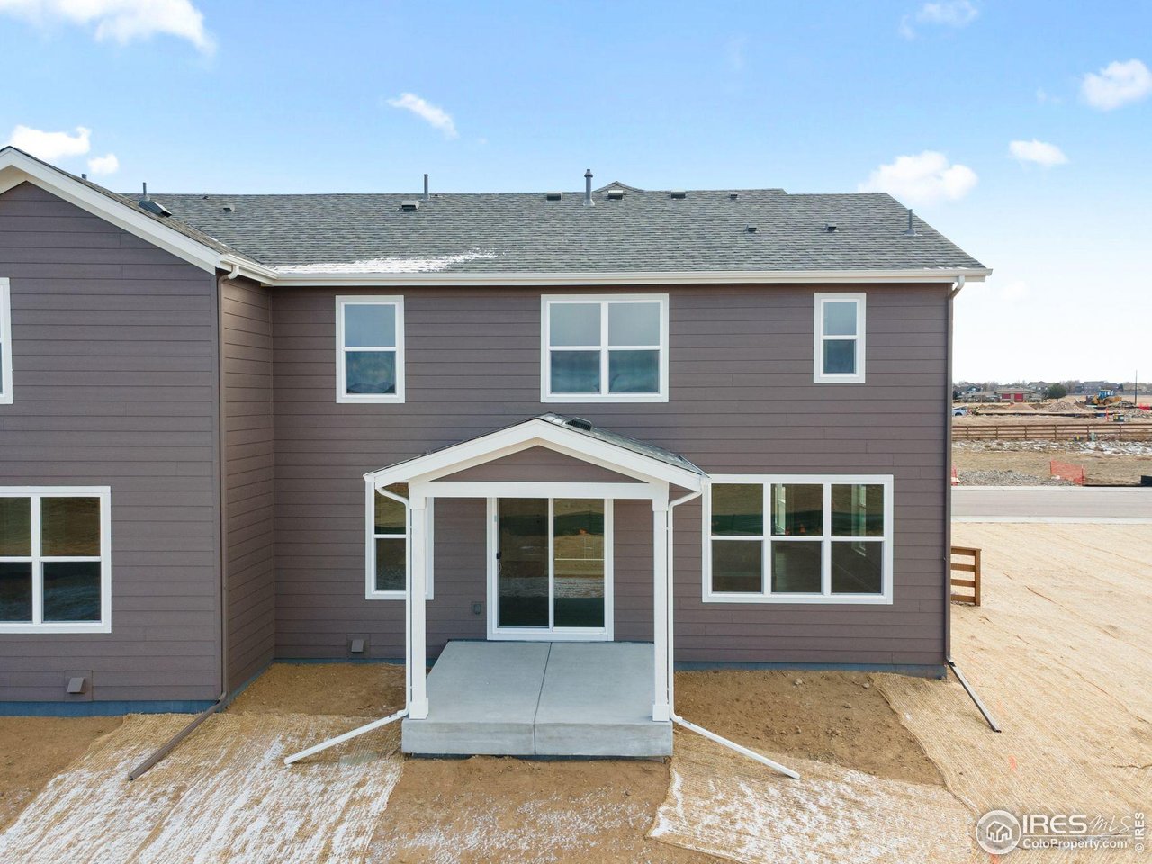 6765 Utica Court Firestone, CO 80504 - Photo 21 of 23 a front view of a house with a yard