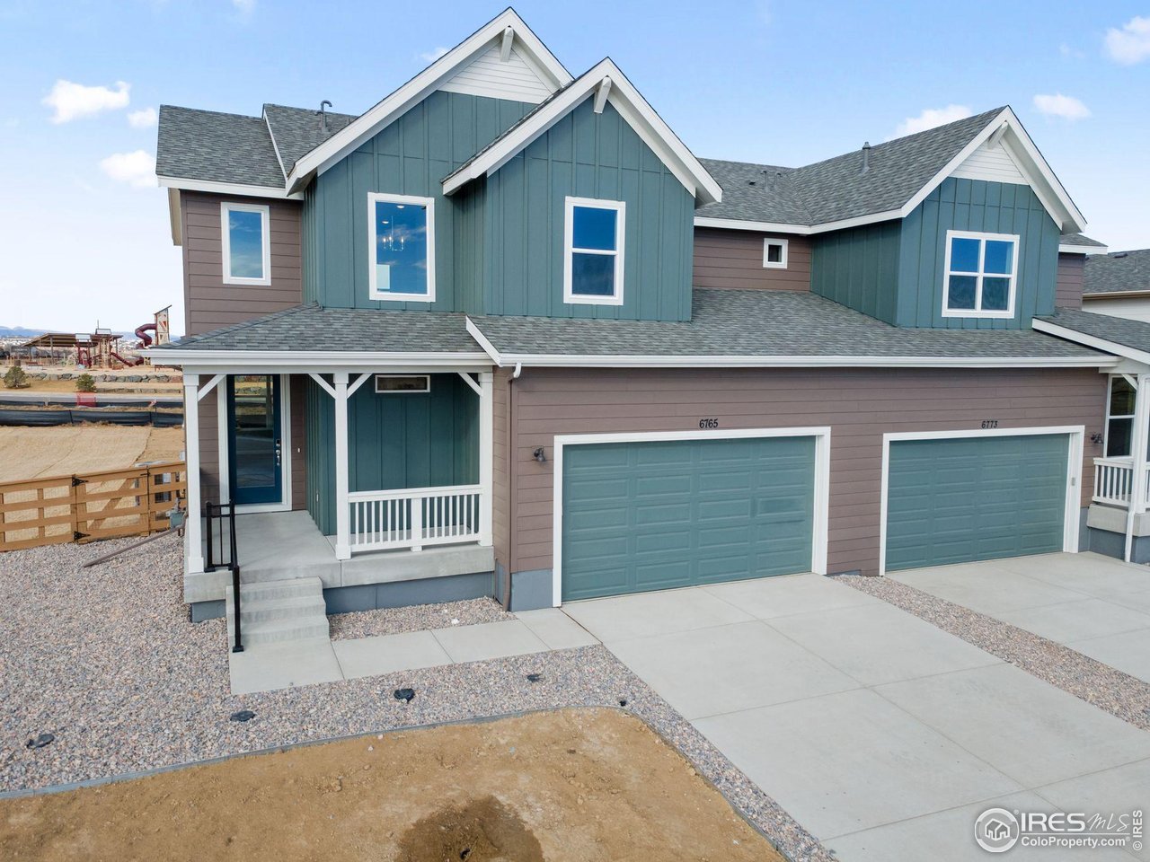 6765 Utica Court Firestone, CO 80504 - Photo 22 of 23 a front view of a house with a garage and balcony