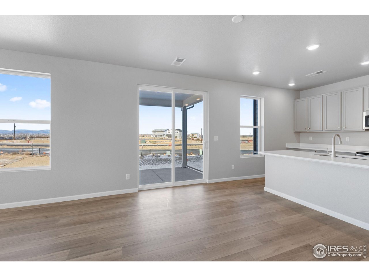 6765 Utica Court Firestone, CO 80504 - Photo 4 of 23 a view of a kitchen with wooden floor