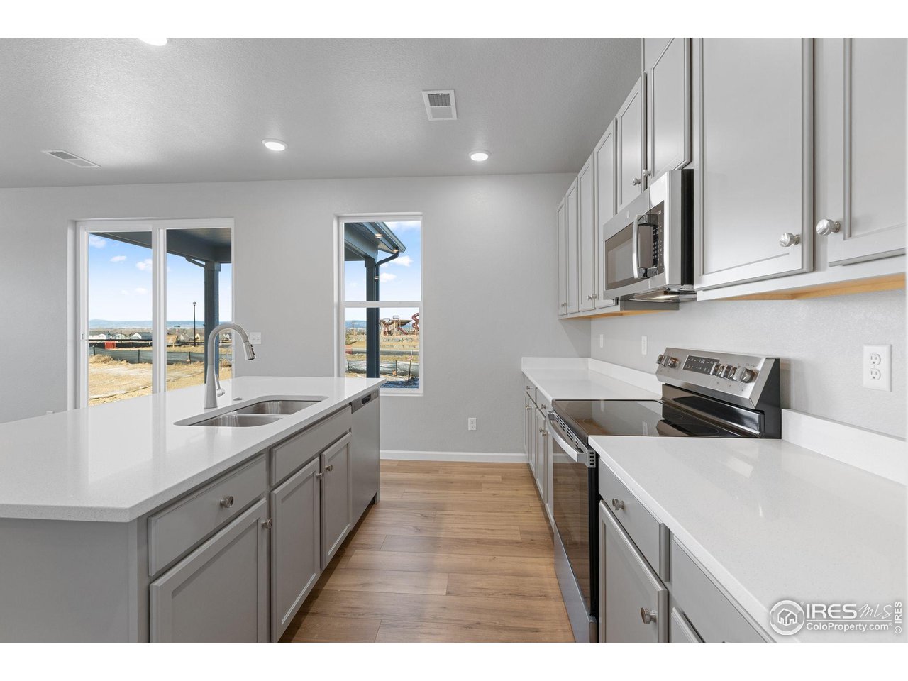 6765 Utica Court Firestone, CO 80504 - Photo 8 of 23 a kitchen with sink and cabinets