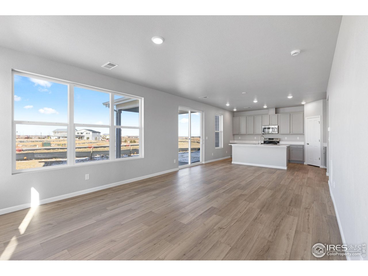 6765 Utica Court Firestone, CO 80504 - Photo 9 of 23 a view of kitchen with wooden floor