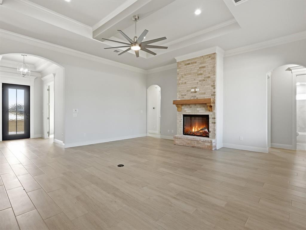 3152 Infinity Drive Weatherford, TX 76087 - Photo 22 of 40 a view of an empty room with a fireplace