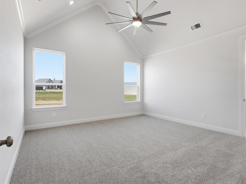 3152 Infinity Drive Weatherford, TX 76087 - Photo 24 of 40 an empty room with a window and ceiling fan