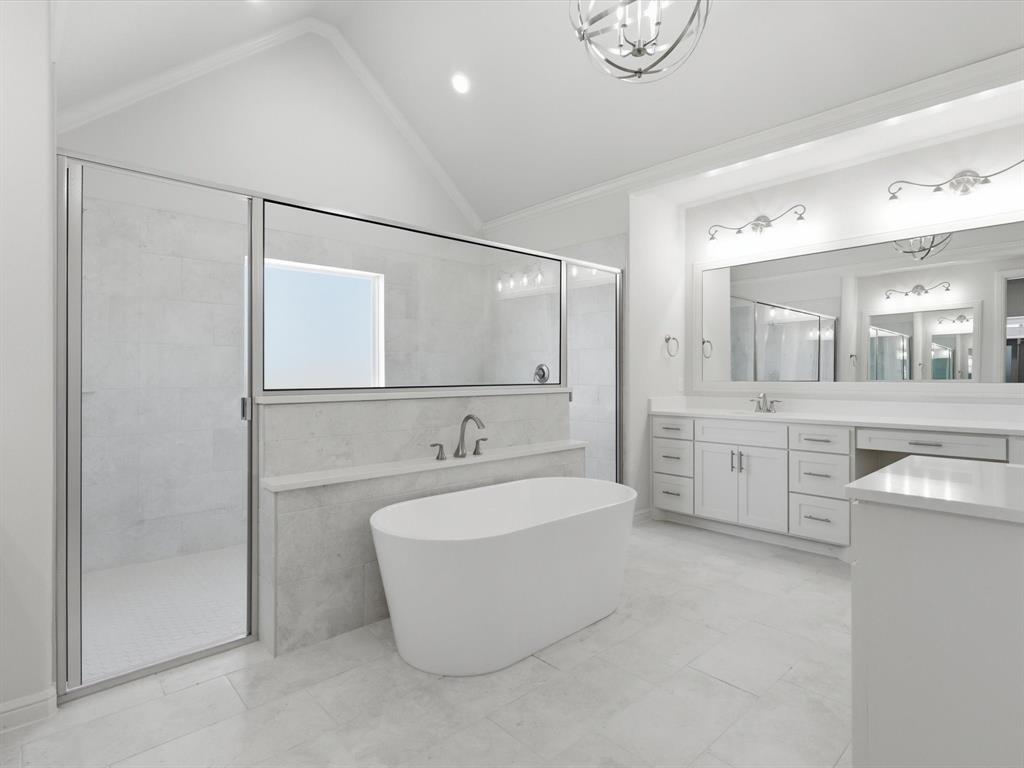 3152 Infinity Drive Weatherford, TX 76087 - Photo 26 of 40 a large bathroom with a tub sink and mirror
