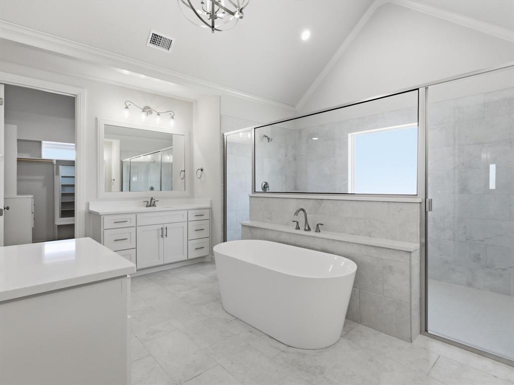 3152 Infinity Drive Weatherford, TX 76087 - Photo 27 of 40 a bathroom with a tub sink shower and mirror