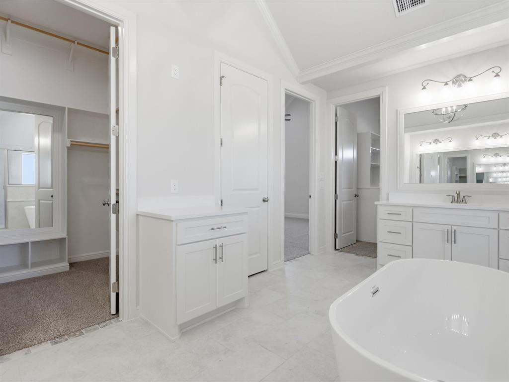 3152 Infinity Drive Weatherford, TX 76087 - Photo 28 of 40 a spacious bathroom with a bathtub shower sink and mirror