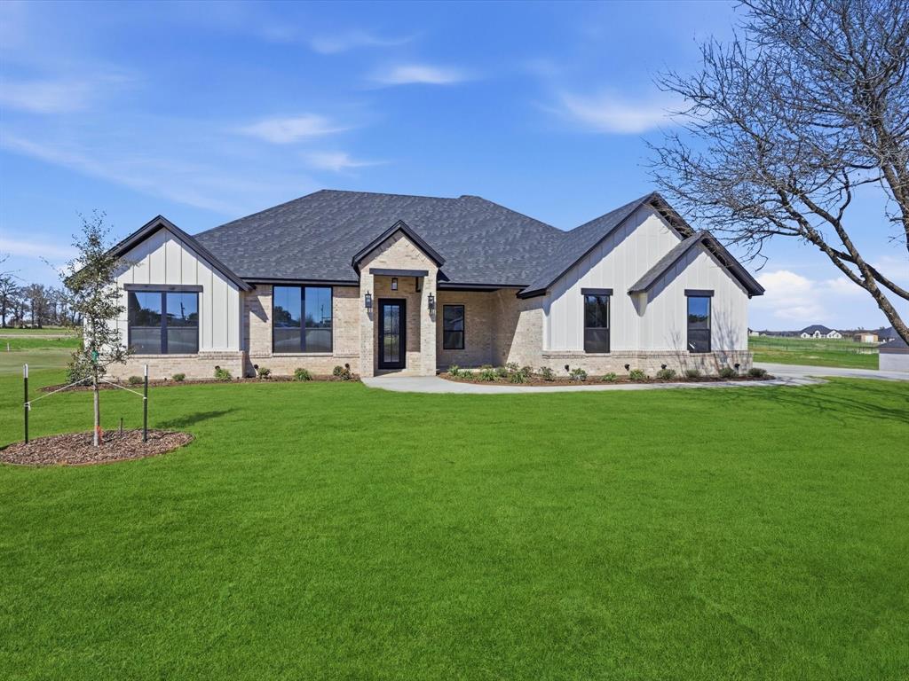 3152 Infinity Drive Weatherford, TX 76087 - Photo 3 of 40 a view of house with a big yard and large trees
