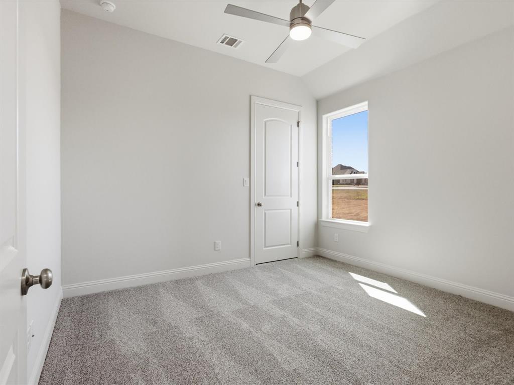 3152 Infinity Drive Weatherford, TX 76087 - Photo 33 of 40 an empty room with a fan & a window