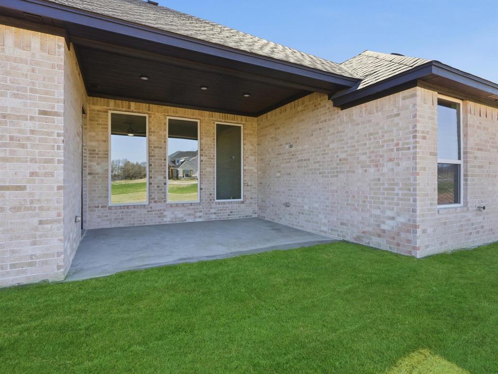 3152 Infinity Drive Weatherford, TX 76087 - Photo 37 of 40 a view of an house with backyard and garden