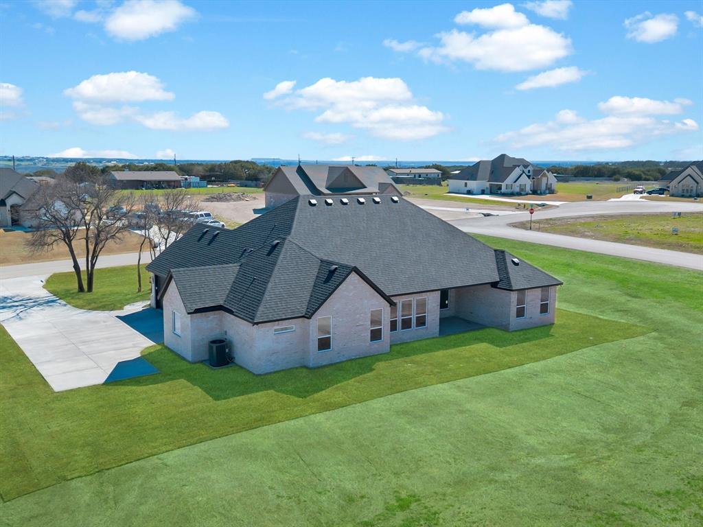 3152 Infinity Drive Weatherford, TX 76087 - Photo 38 of 40 a view of a house with big yard and large trees