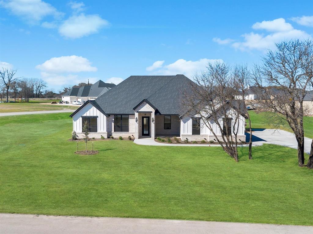 3152 Infinity Drive Weatherford, TX 76087 - Photo 4 of 40 a view of a house with a yard