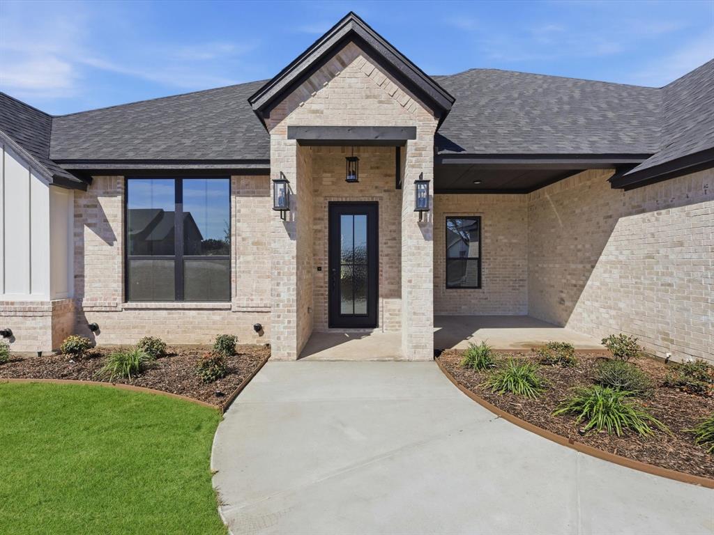 3152 Infinity Drive Weatherford, TX 76087 - Photo 5 of 40 a front view of a house with a yard