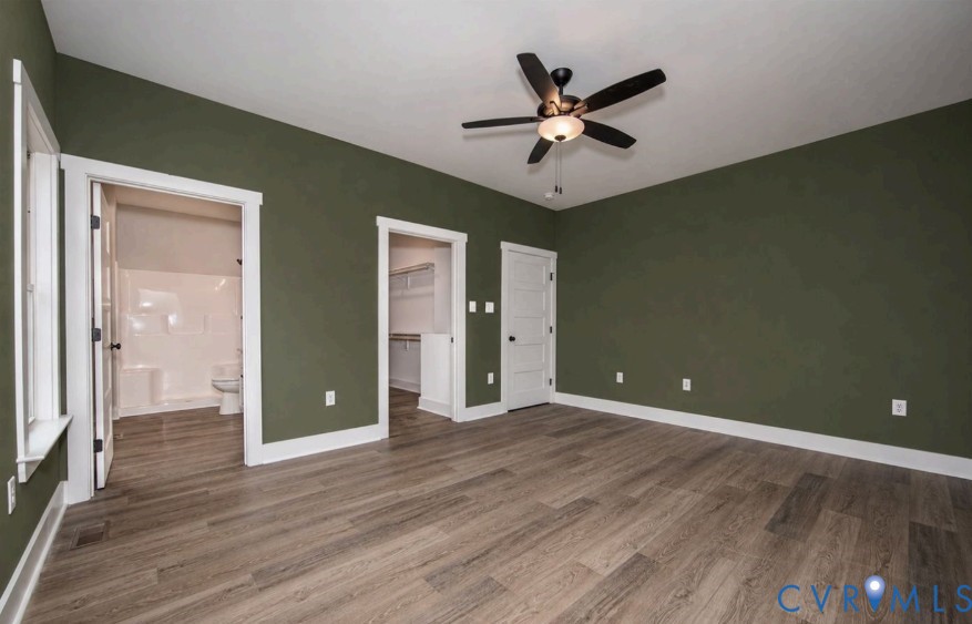 115 Jenkins Church Road Cumberland, VA 23040 - Photo 8 of 16 Wood-finish flooring, dark green walls, white trim