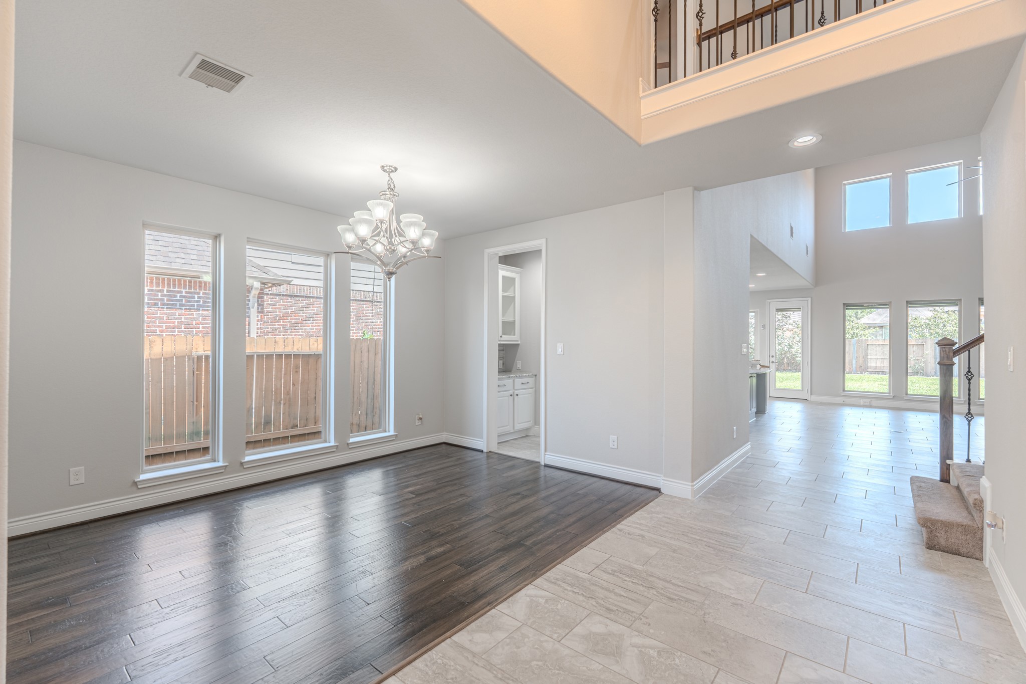 27918 Madison Bend Drive Spring, TX 77386 - Photo 8 of 50 a view of an empty room with glass door and windows