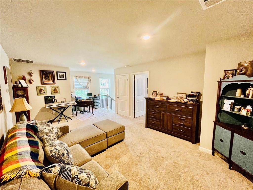 3015 Winding Ridge Waleska, GA 30183 - Photo 22 of 40 a living room with furniture and a flat screen tv