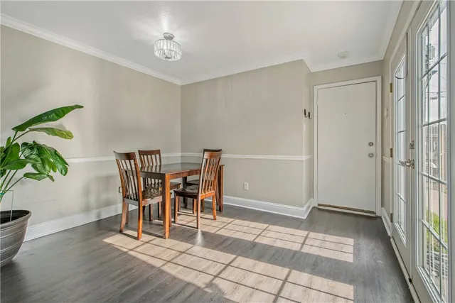 a view of a dining room with furniture and a potted plant