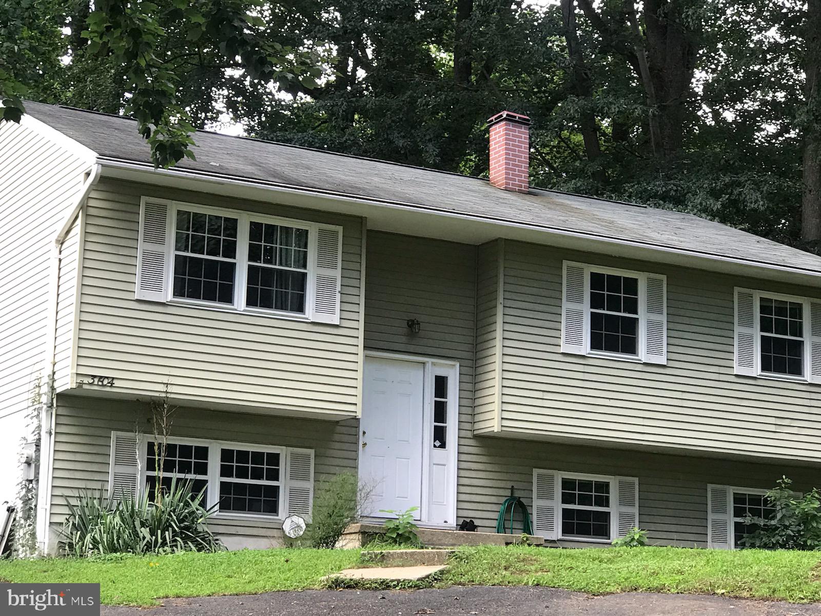 3604 4th Street North Beach, MD 20714 - Photo 2 of 14 a front view of a house with a yard