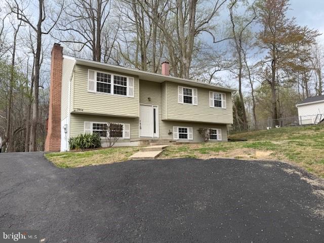 3604 4th Street North Beach, MD 20714 - Photo 3 of 14 a front view of a house with a yard and trees