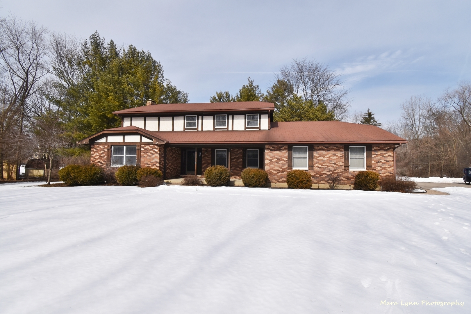 36W818 Oak Road St. Charles, IL 60175 - Photo 1 of 46 a front view of a house with a yard and garage