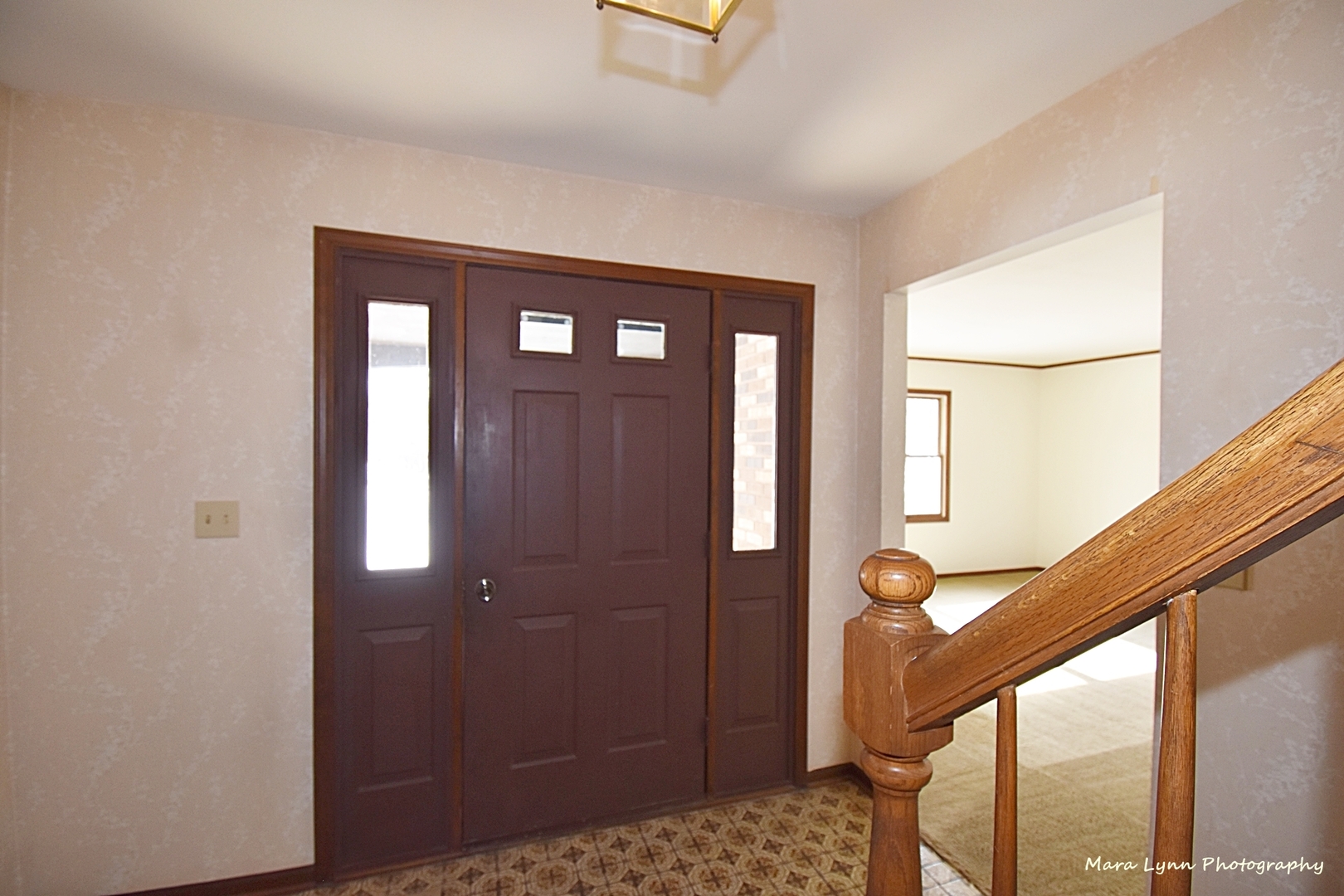 36W818 Oak Road St. Charles, IL 60175 - Photo 4 of 46 a view of a hallway with wooden floor and staircase