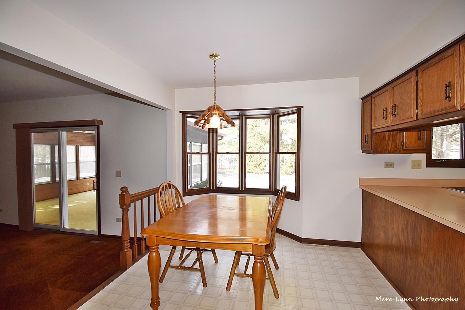36W818 Oak Road St. Charles, IL 60175 - Photo 9 of 46 a view of a dining room with furniture window and wooden floor