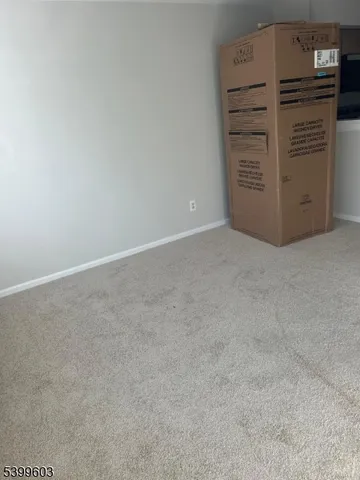 an empty room with furniture