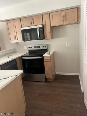 a kitchen with a stove and a microwave