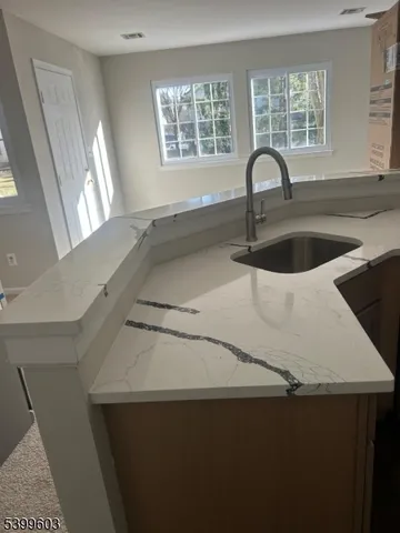 a kitchen with a sink and a window