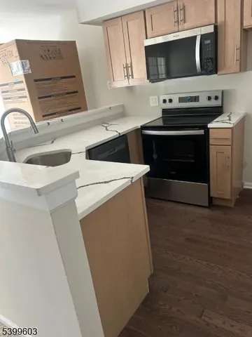 a kitchen with a stove and a microwave