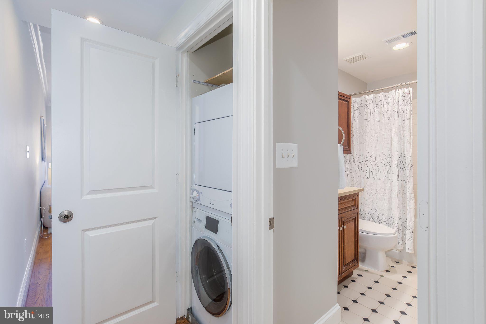 1116 C Street Northeast, Unit 202 Washington, DC 20002 - Photo 28 of 30 Efficient laundry nook with bath access.