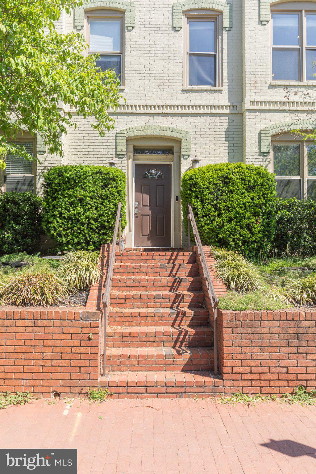1116 C Street Northeast, Unit 202 Washington, DC 20002 - Photo 3 of 30 Charming entrance with lush greenery.