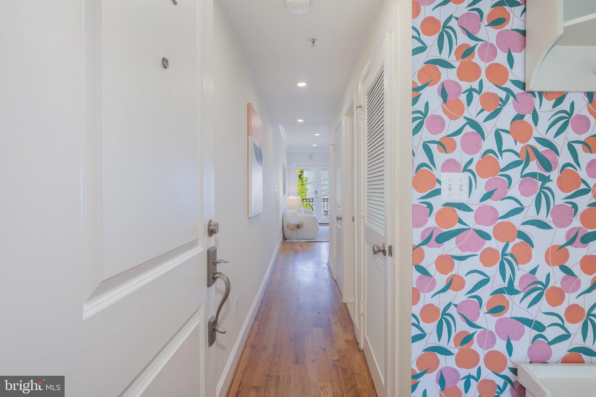 1116 C Street Northeast, Unit 202 Washington, DC 20002 - Photo 4 of 30 Vibrant hallway with playful decor.