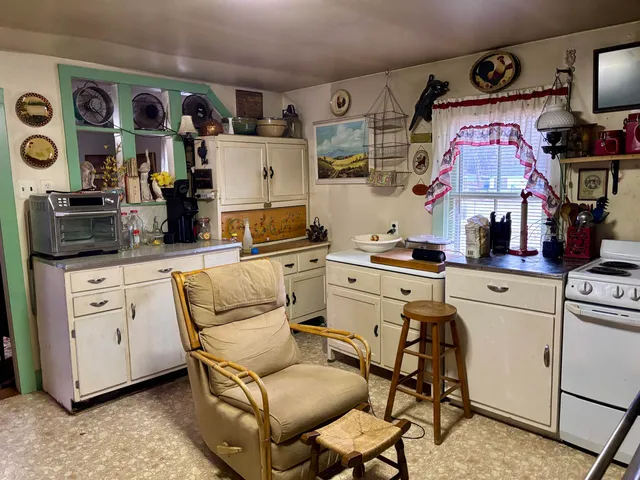 a kitchen with stainless steel appliances granite countertop a sink and cabinets