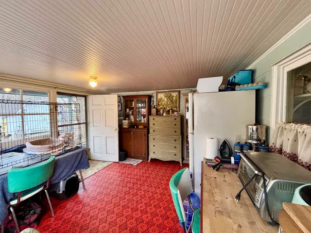 a room with furniture and a window