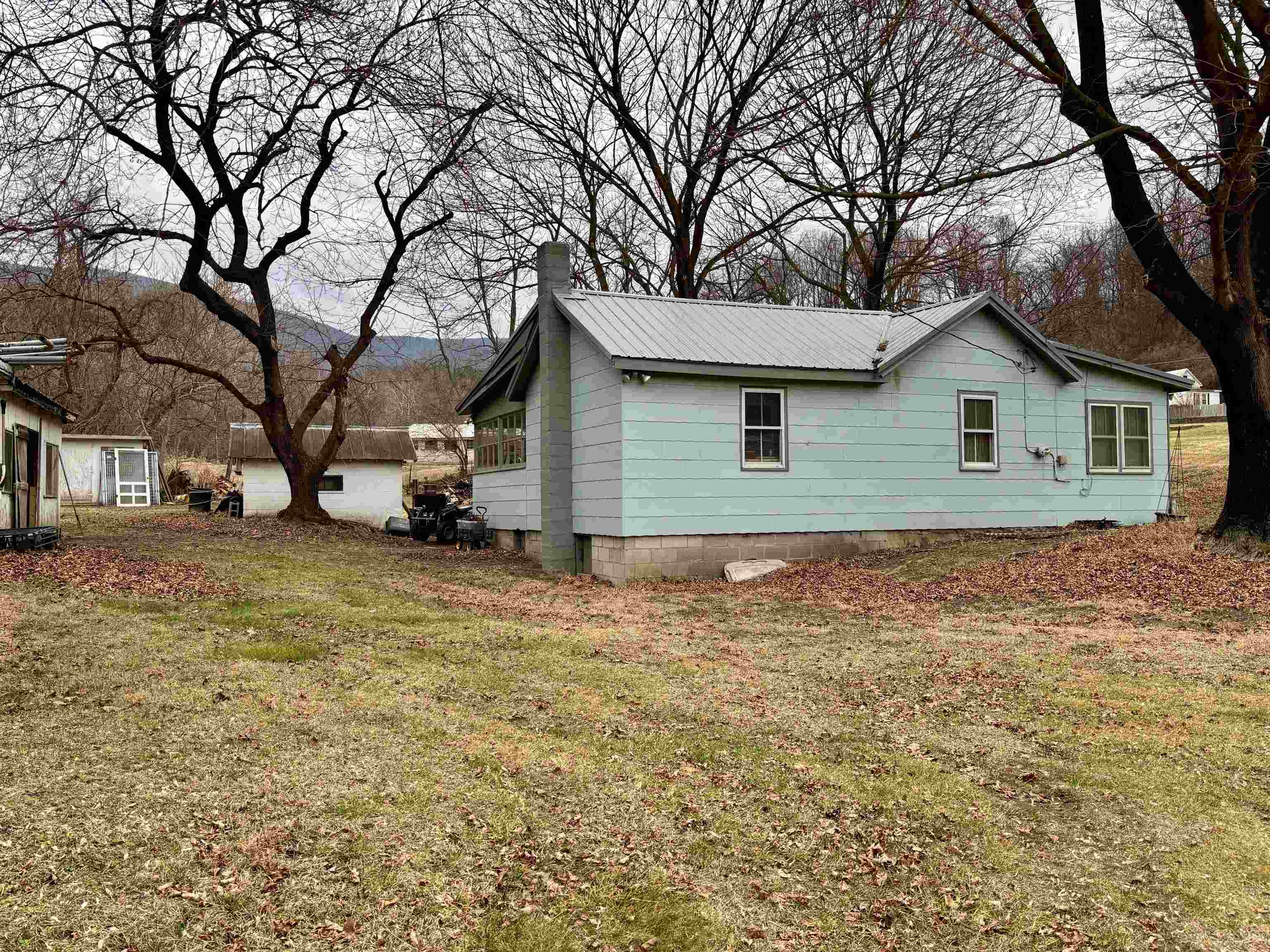 3485-3465 Pine Grove Road Stanley, VA 22851 - Photo 30 of 47 a view of a house with a yard and garage