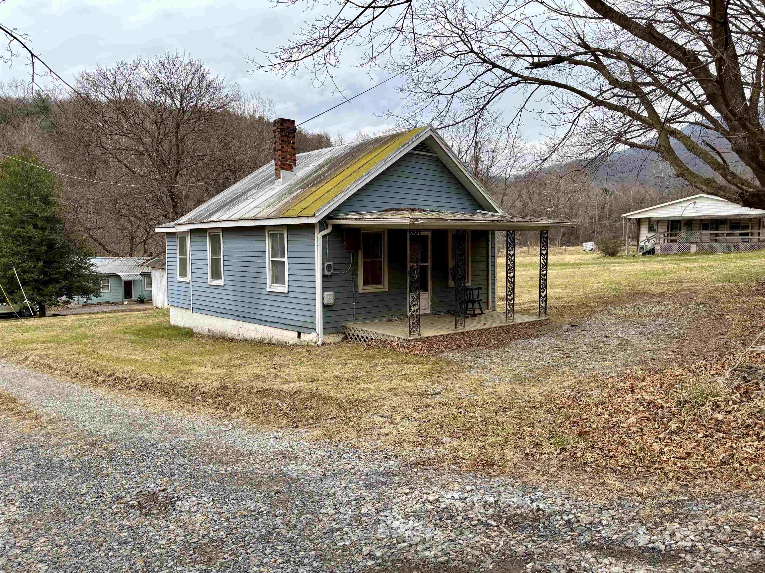 3485-3465 Pine Grove Road Stanley, VA 22851 - Photo 35 of 47 a front view of a house with a yard