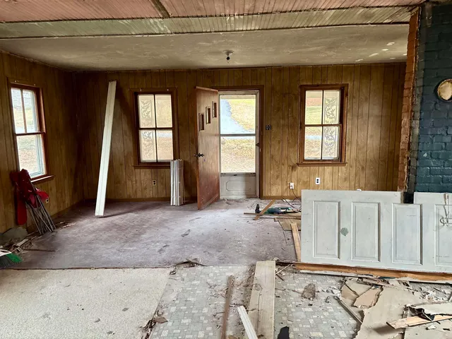 a view of a livingroom with furniture and windows