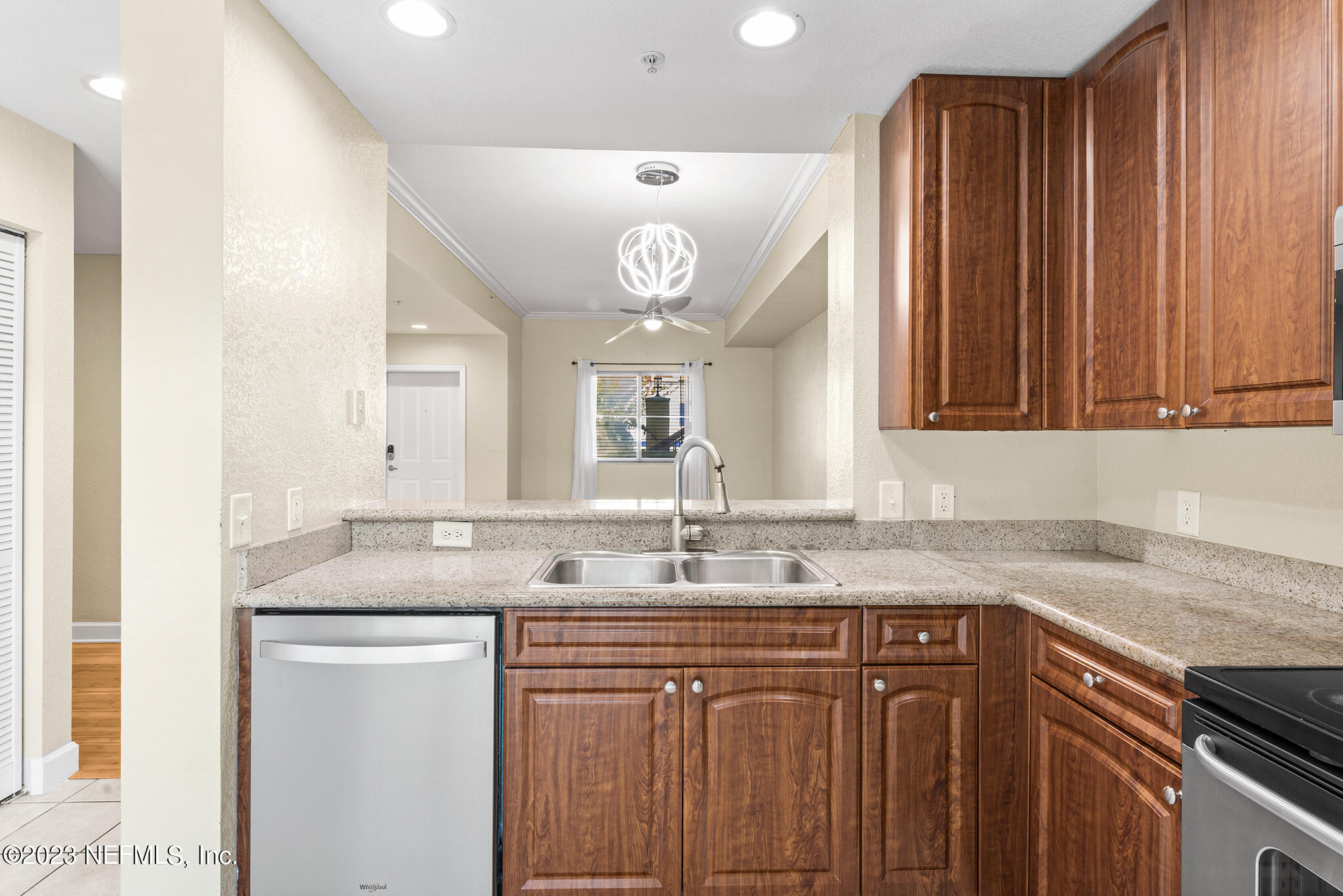 9745 Touchton Road, Unit 2003 Jacksonville, FL 32246 - Photo 13 of 34 a bathroom with a granite countertop sink and a mirror