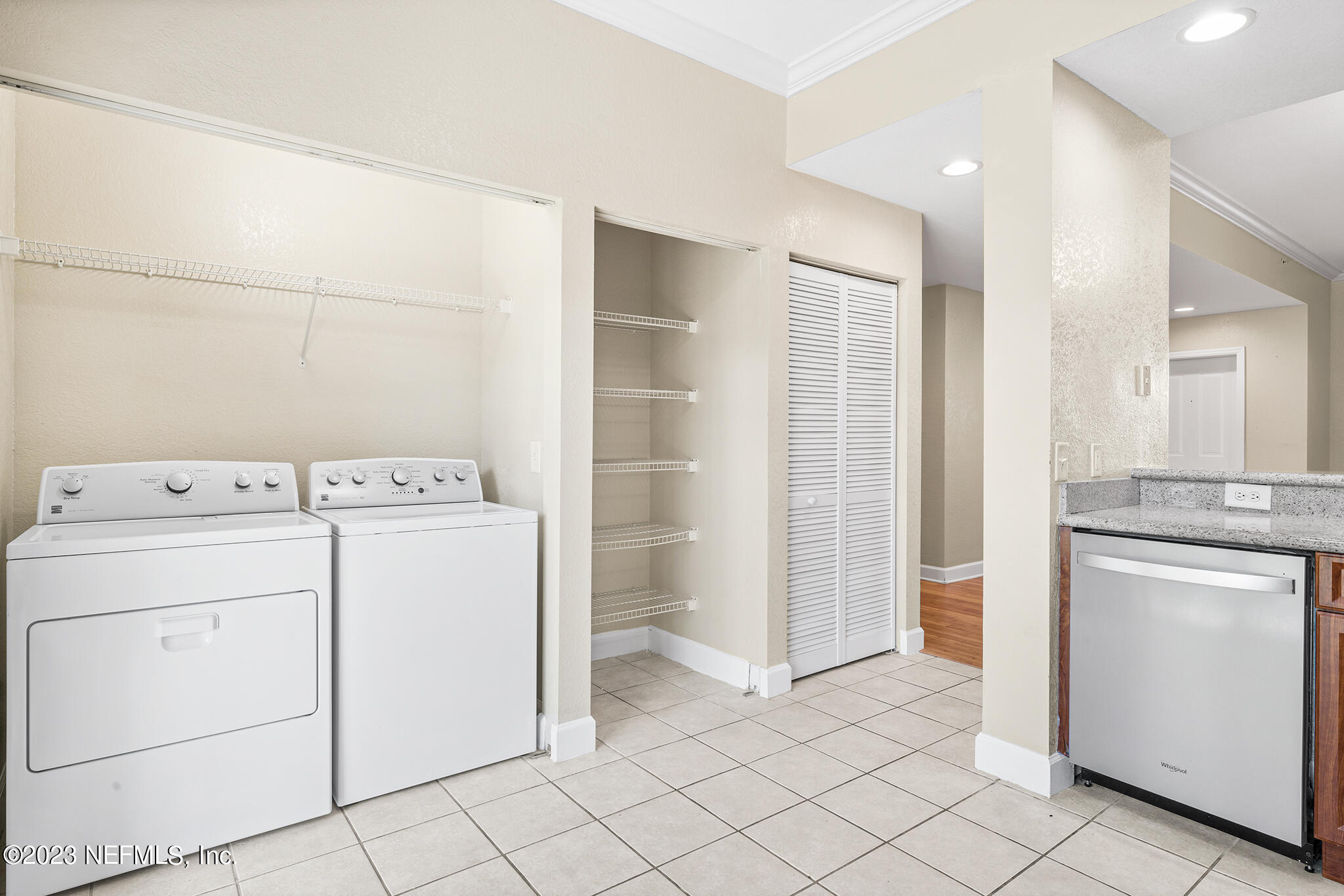 9745 Touchton Road, Unit 2003 Jacksonville, FL 32246 - Photo 14 of 34 a view of storage and utility room with closet dryer and washer
