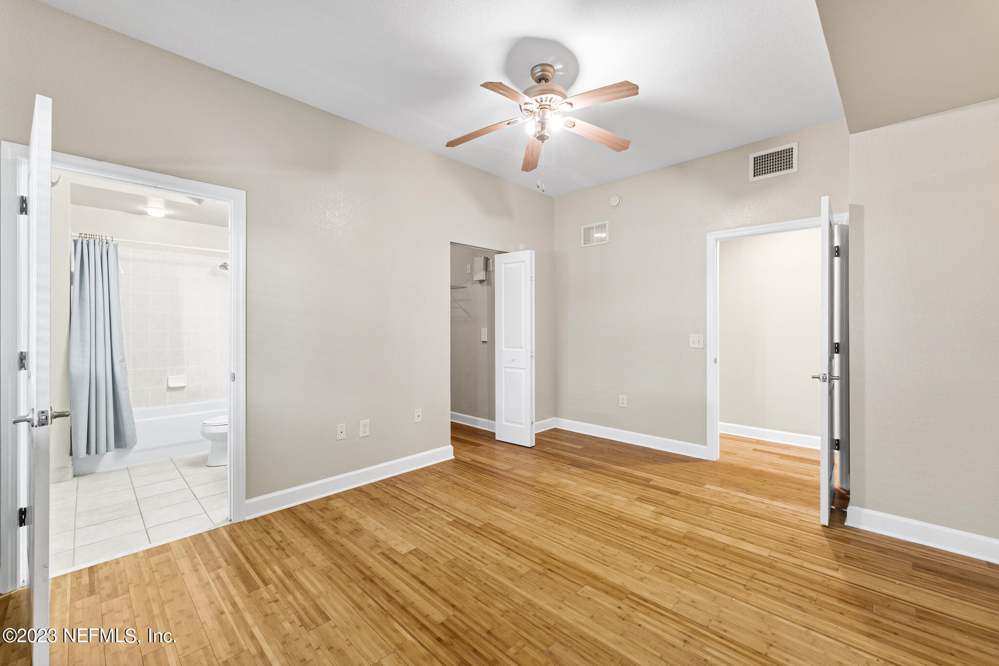 9745 Touchton Road, Unit 2003 Jacksonville, FL 32246 - Photo 16 of 34 a view of an empty room with wooden floor