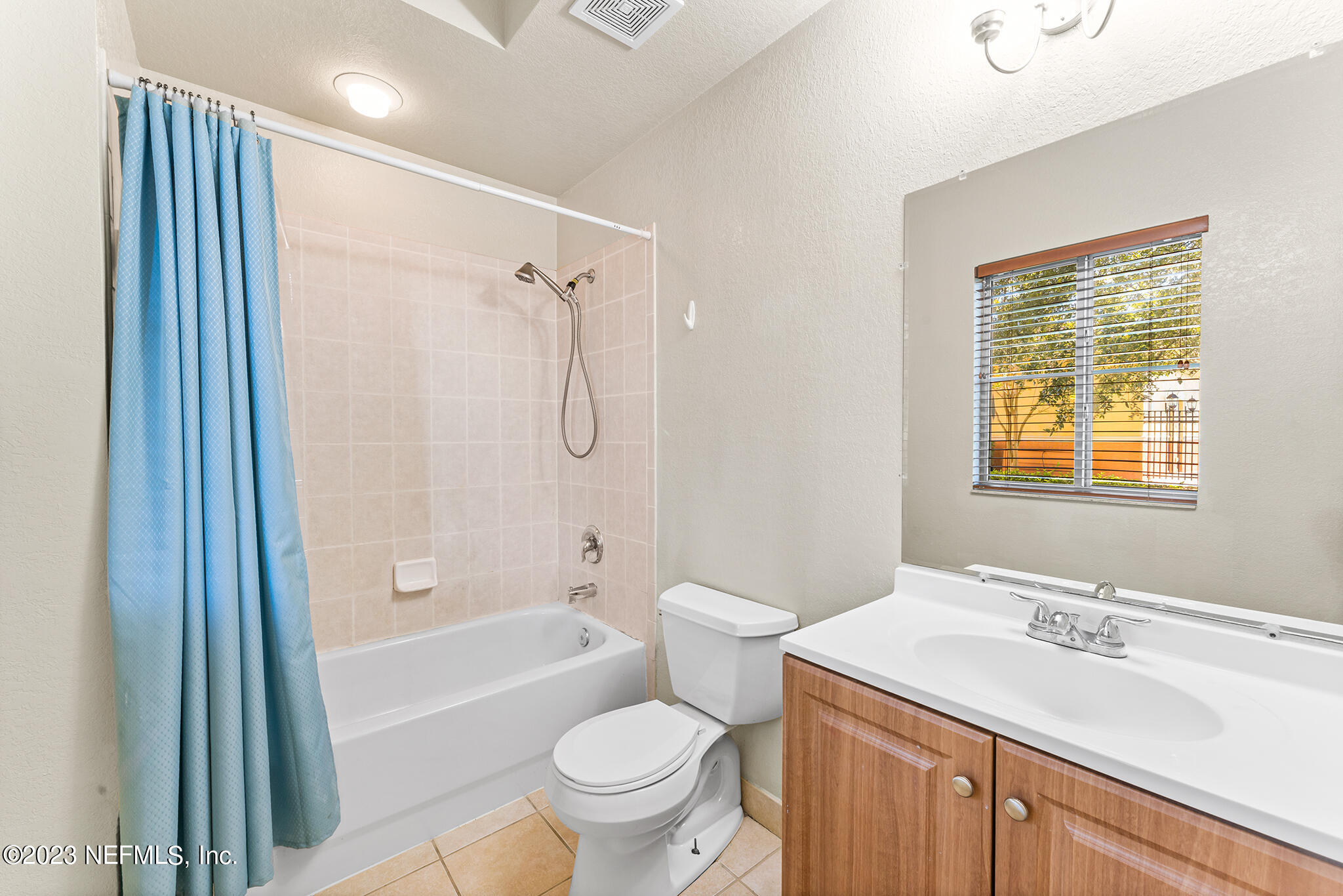 9745 Touchton Road, Unit 2003 Jacksonville, FL 32246 - Photo 17 of 34 a bathroom with a sink toilet tub and shower