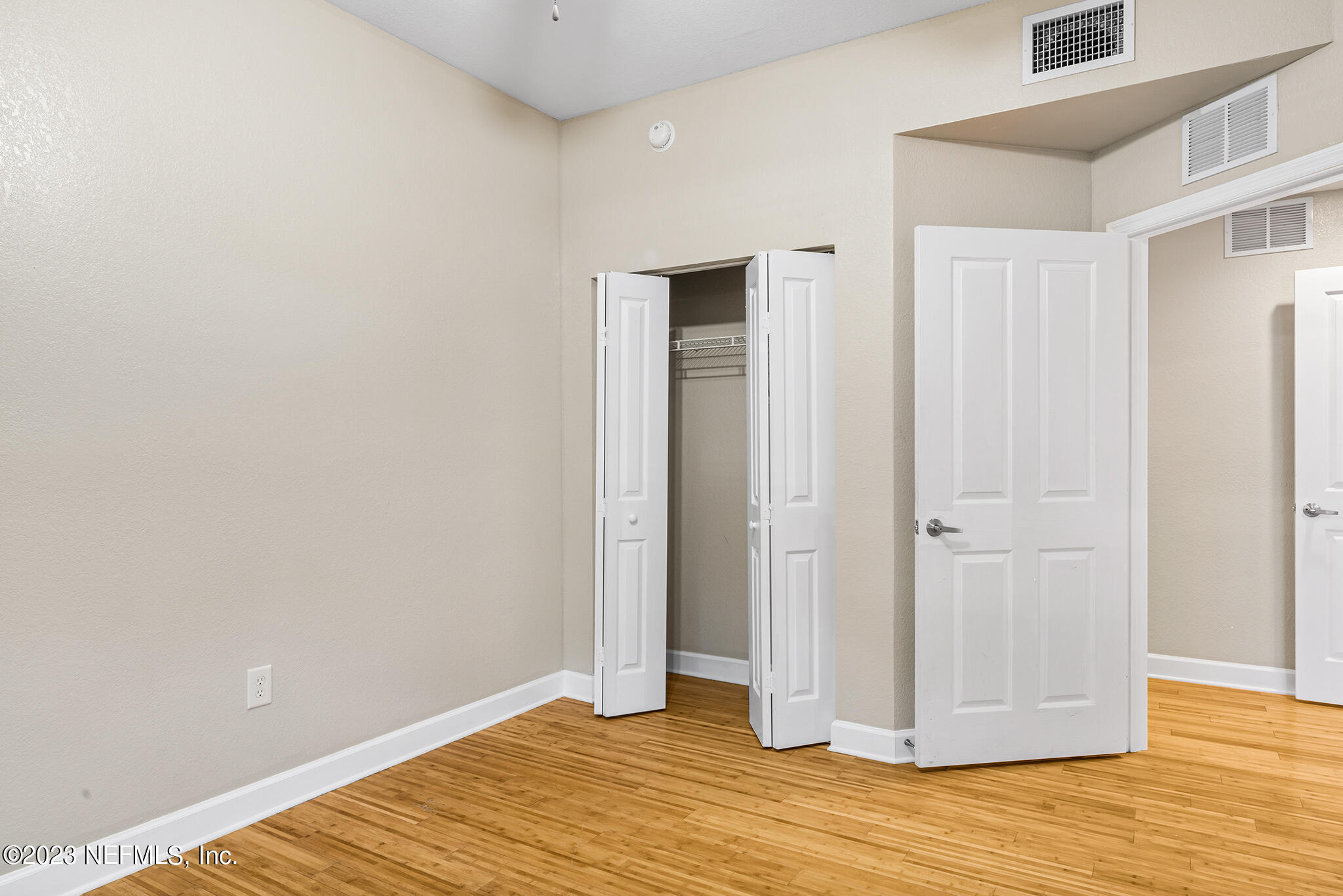 9745 Touchton Road, Unit 2003 Jacksonville, FL 32246 - Photo 19 of 34 a view of an empty room with wooden floor