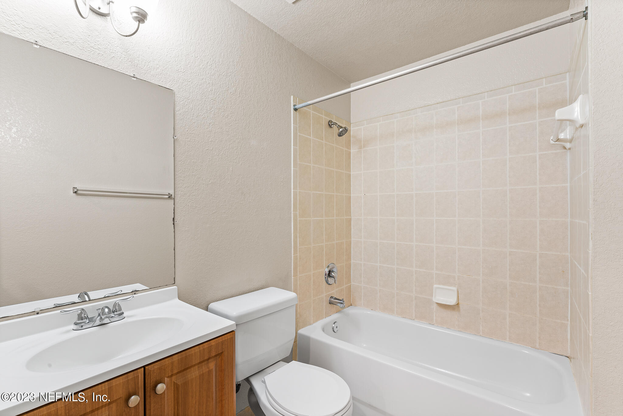 9745 Touchton Road, Unit 2003 Jacksonville, FL 32246 - Photo 20 of 34 a bathroom with a sink toilet and shower