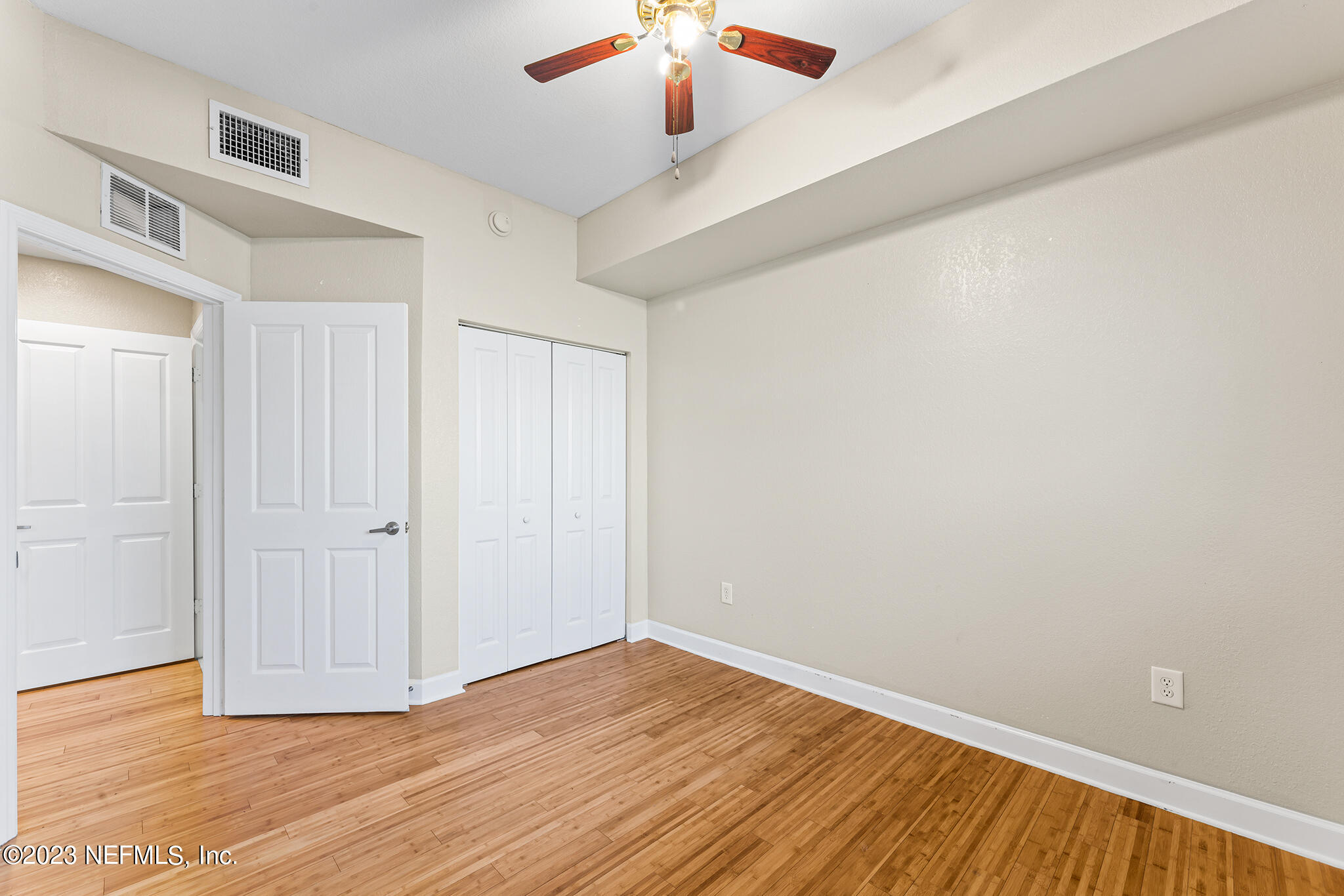 9745 Touchton Road, Unit 2003 Jacksonville, FL 32246 - Photo 22 of 34 a view of empty room with wooden floor