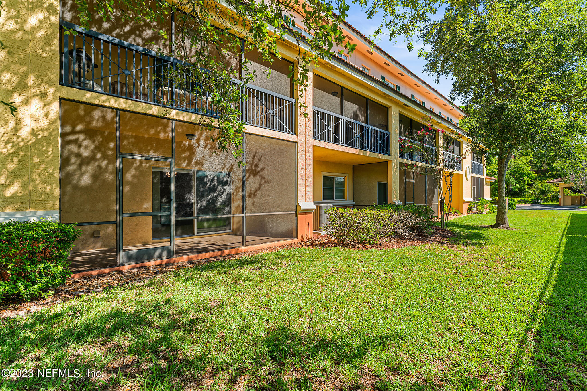 9745 Touchton Road, Unit 2003 Jacksonville, FL 32246 - Photo 26 of 34 a view of a building with a yard