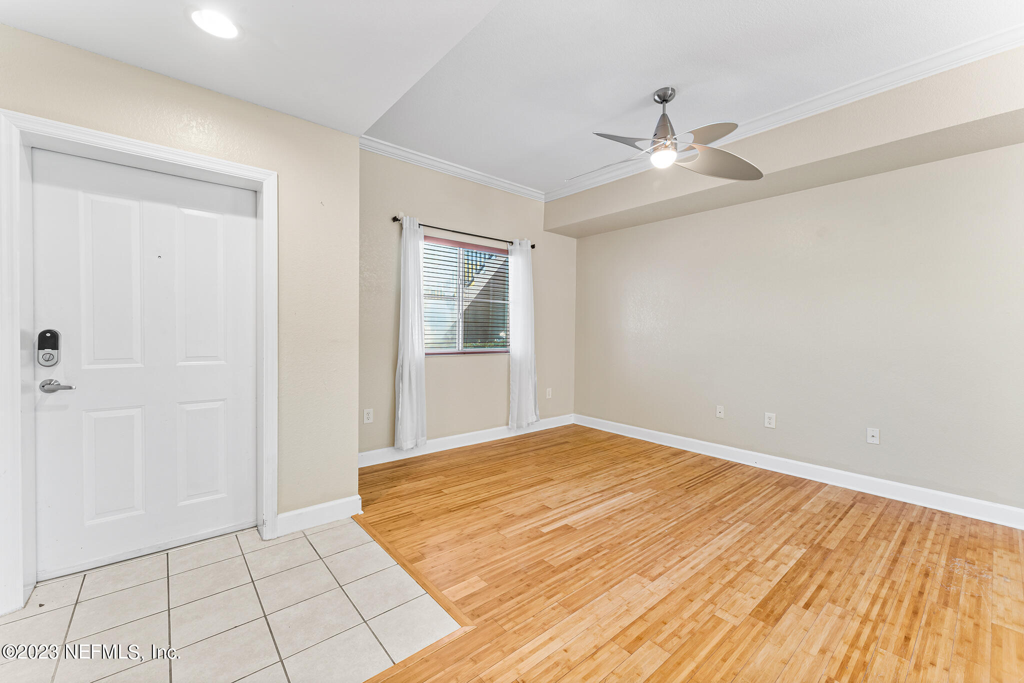 9745 Touchton Road, Unit 2003 Jacksonville, FL 32246 - Photo 8 of 34 wooden floor in an empty room with a window