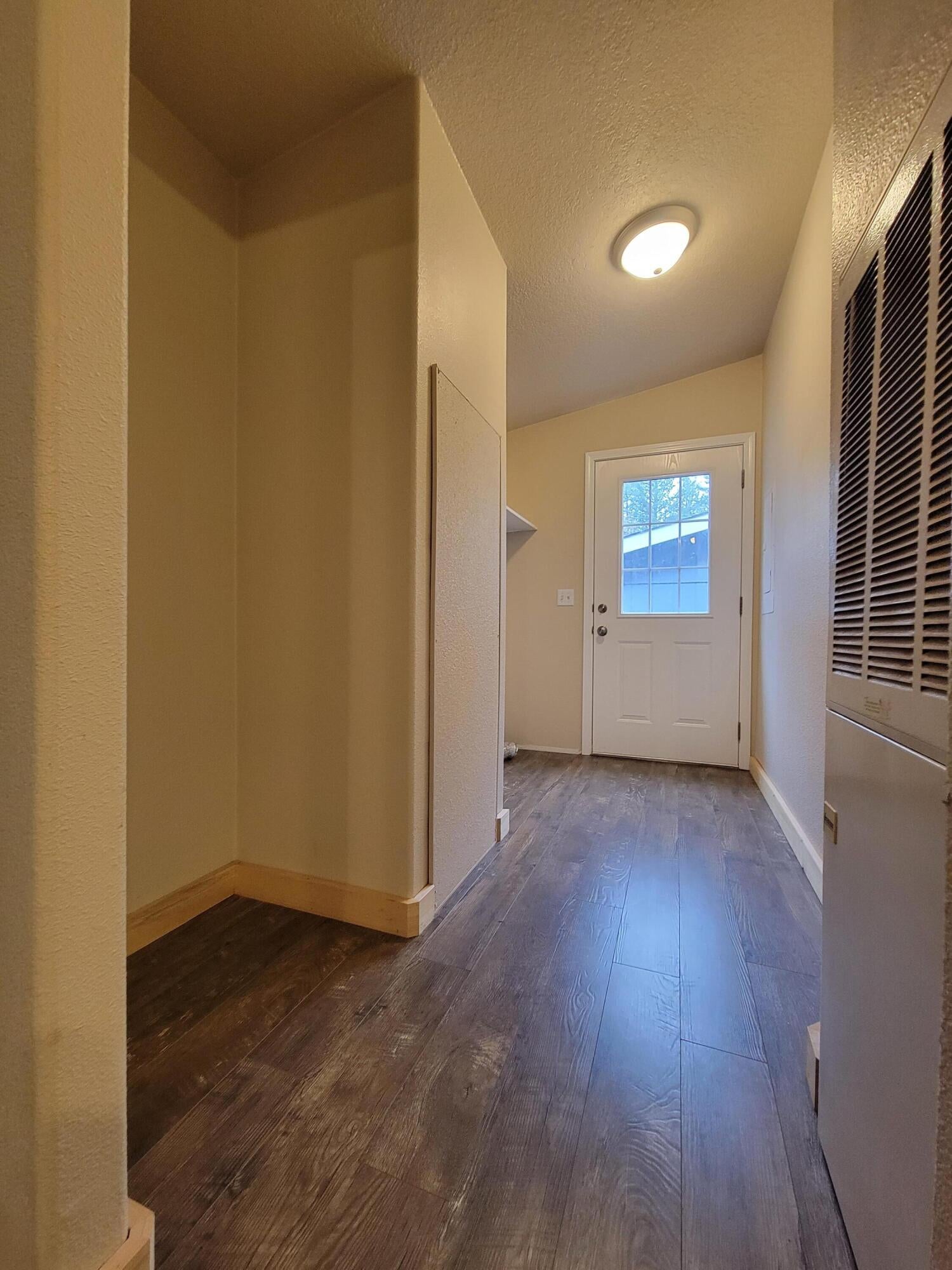 447 Fee Street Butte Falls, OR 97522 - Photo 11 of 16 Laundry room leading to back door.