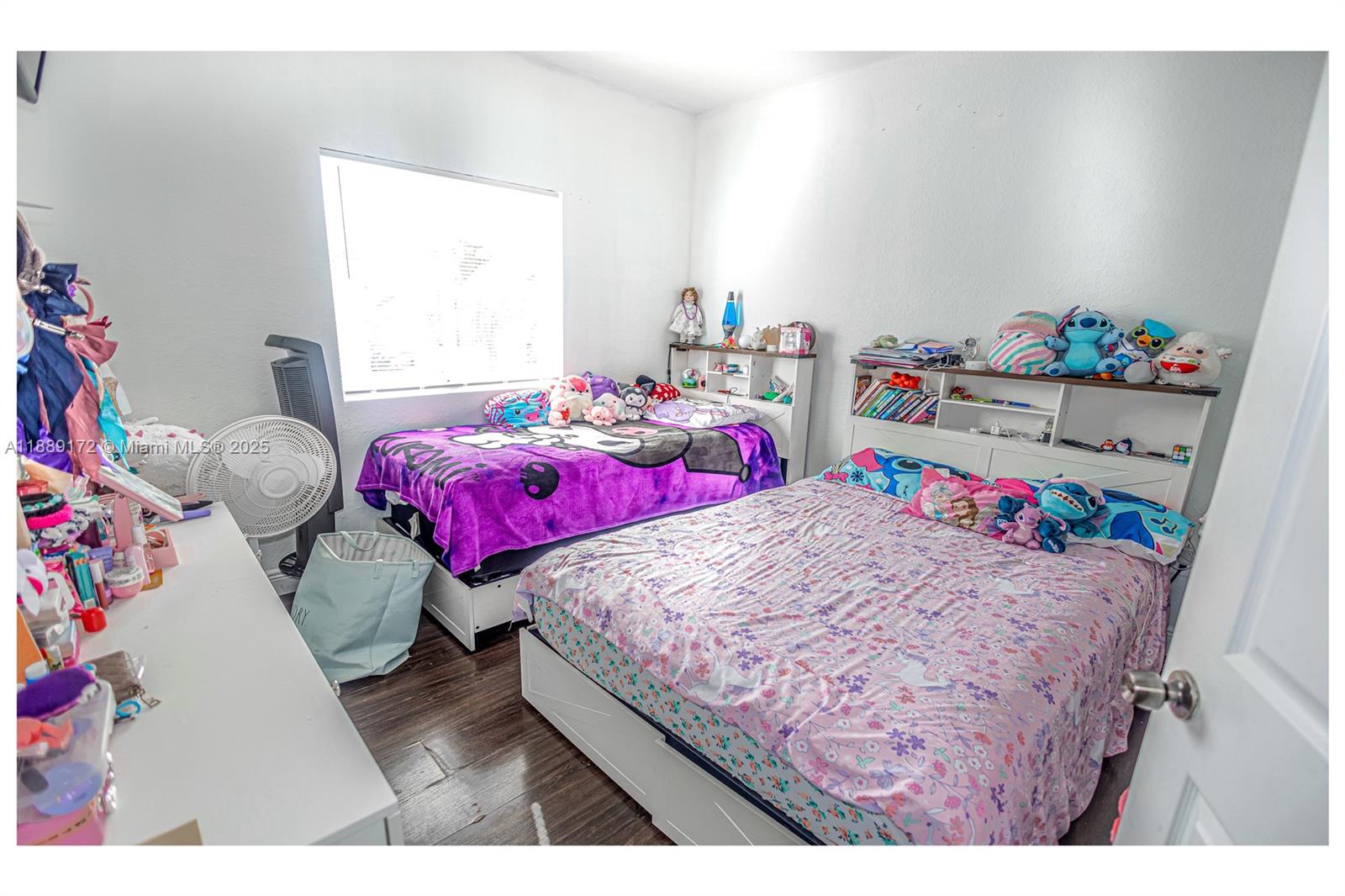 18272 Southwest 108th Path Miami, FL 33157 - Photo 15 of 27 a bedroom with a bed a dresser and a window